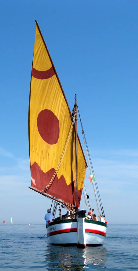 Boat with colorful sail and the adriatic sea rimini photo